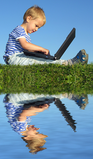 Here are links to sites for general eye healthcare information Image of a child on a laptop by a lake